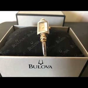 Women’s silver and gold bulova watch